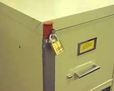 a file cabinet with a padlock on it