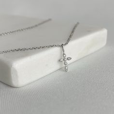 Sterling Silver Minimalist Cross Necklace is not only a beautiful piece of jewelry, but it also holds sentimental value. It serves as both a stylish accessory and a symbol of faith. Whether you wear it as a personal reminder or as a meaningful gift for a loved one, this dainty religious necklace is a cherished keepsake that will be treasured for years to come. Product Details:  ◆ Made of 925 Sterling Silver ◆ Necklace length adjustable 40cm+5cm extender ◆ Weight 1.2g Packaging: All our jewellery Dainty Cross Necklace, Necklace Christian, Sterling Silver Cross Necklace, Jewelry Minimalist, Christian Jewelry, Sterling Silver Cross, Necklace Dainty, Necklace Length, Stylish Accessories