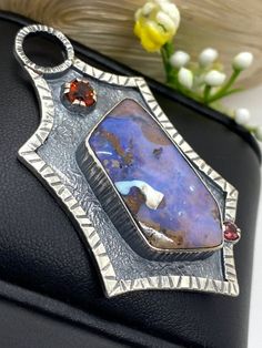 "Australian Boulder Opal pendant in sterling silver Hand-made Sterling Silver 925 Stones used: Australian Boulder Opal, High Qualty Citrine Height - 2 1/4\" (with bail), Width - 1 1/4\" Unique Handcrafted One-of a-kind Design Pendant Each Piece of Jewelry in my Collection is Absolutely One of a Kind! When you start wearing a piece of my jewelry you will fall in love with it more and more each day and feel that good Energy and Love that I pass into it while creating this piece of Art. A piece of Artisan Blue Pendant Jewelry, Unique Opal Cabochon Jewelry, Art Nouveau Opal Pendant, Luxury Artisan Opal Necklace, Boulder Opal Pendant, Australian Boulder Opal, Garnet Stone, Handcrafted Rings, Unique Gemstones