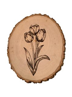 a piece of wood with flowers drawn on it