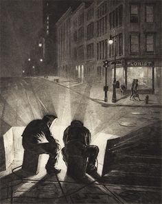 two people kneeling down in the street at night