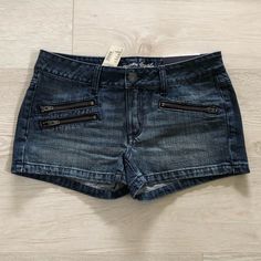 Nwt American Eagle Ae Zip Pocket Stretch Denim Jean Shortie Shorts. Size 6 Indigo Blue Dark Wash Color. Super Cute And Trendy Jean Shorts. Features: 3 Zip Pockets In Front. Five-Pockets Silhouette. Soft & Stretchy. Zip Fly & Logo Button Closure. Belt Loops. Shortie Sexy Style. 100% Cotton. Machine Washable. Brand New With Tags In Excellent Condition. From A Clean, Smoke Free And Pet Free Home. Denim Zip Fly Shorts, Fitted Dark Wash Jean Shorts With Pockets, Fitted Cutoff Jean Shorts With Pockets, Denim Jean Shorts With Zipper Closure, Summer Jean Shorts With Zip Fly, Cotton Shorts With Zipper Closure, Casual Shorts With Zipper Closure, Denim Cutoff Shorts With Zipper Closure, Cutoff Denim Shorts With Zipper Closure