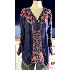 New With Tags Size Small This Beautiful Navy Tunic Is The Perfect Example Of Why Johnny Was Is Everyone’s Favorite Bohemian Designer. The Details Are Stunning And So Well Done. This Blouse Has Intricate Red, Light Blue, Pink, Beige And White Embroidery Covering The Entirety Of It. The Embroidery Includes Floral Designs Mixed With Mosaic Decorations And A Few Gorgeous Butterflies For A Touch Of Whimsy. It Is A Longsleeve Piece With A Flattering V-Neck. The Top Has Traditional Peasant Top Neck Ties. *There Is A Tiny Pulled Thread On One Sleeve As Shown In The Closeup Sleeve Picture. Measurements Laying Flat: Length 31” Bust 20” Blue Long Sleeve Embroidered Top With Floral Detail, Red Tunic Top, Check Tunic, Red Tunic, Rayon Blouse, Tie Dye Tunics, Embroidered Scarf, Embroidered Tunic Top, Floral Tunic Tops