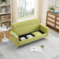 a green couch sitting on top of a white rug