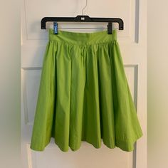 Nwt Trashy Diva High Waisted Green Circle Skirt With Pockets Sz 2 One Small Water Mark Where I Cleaned Up Some Surface Dirt, Should Come Out When Cleaned And Not Noticeable With The Fullness Of The Skirt 97% Cotton 3% Spandex Approximately 11.5” Waist 19” Long Non Smoking Home Casual Green Pleated Full Skirt, Pleated Green Full Skirt, Fitted Green Pleated Midi Skirt, Green Flared Skirt With Elastic Waistband, Green Knee-length Cotton Skirt, Green Cotton Knee-length Skirt, Green Lined Skirted Bottoms, Green Flowy Cotton Skirt, Green Cotton Midi Skirt