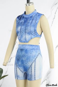 Olivia Mark - Chic Asymmetrical O Neck Sleeveless Two-Piece Set Featuring Blue Casual Street Print and Bandage Patchwork Blue Cropped Vest For Summer, Fitted Blue Vest For Summer, Blue Fitted Sleeveless Crop Top, Fitted Blue Tank Vest, Blue Fitted Tank Vest, Casual Sets, Classic Blue, Two Piece Sets, Asymmetric Hem