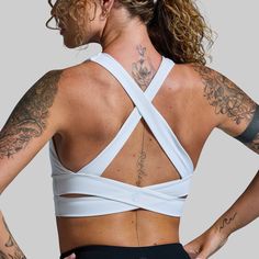 With a longer body and crossed straps in the back, this sports bra was designed with the perfect balance of flexibility and support. Made with our signature BPLegacy fabric to move with you and provide ample support for nearly any activity. Bonus, this sports bra can double as a bathing suit top. Cross Back Sports Bra With Built-in Bra For Training, White Sports Bra With Built-in Padding, White Yoga Sports Bra With Built-in Padding, Cross Back Sports Bra With Straps For Yoga, White Sports Bra With Built-in Padding For Workout, Supportive Cross Back Sports Bra With Built-in Padding, White Activewear With Built-in Padding And 4-way Stretch, Training Sports Bra With Cross Back, Functional White Activewear For Pilates