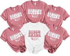 six ladies's disco shirts with the words dancing queens on them in white and pink