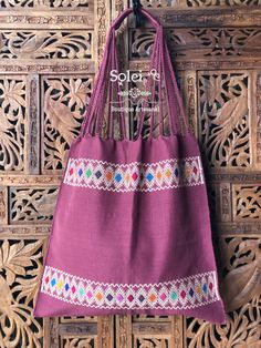 "This gorgeous embroidered Mexican Satchel or Morral is perfect to style with any outfit! The traditional Mexican embroidery is full of culture and colors. This Bag is embroidered on a waist loom. Dimensions: 15.5\" x 15.5\"" Traditional Pink Woven Bag, Traditional Tote Bag With Weaving Work, Traditional Weaving Shoulder Bag For Market, Traditional Pink Embroidered Bag, Traditional Weaving Work Shoulder Bag For Market, Traditional Embroidered Pink Shoulder Bag, Traditional Pink Bags With Floral Embroidery, Traditional Pink Embroidered Shoulder Bag, Traditional Purple Rectangular Bag