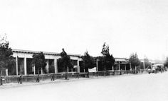 an old black and white photo of a building