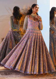 Looking for a versatile ethnic wear then go for the aqsa anarkali gown which is every bit regal. It has mirror work combined with hand embroidery and floral motifs that give an appearance of a walking diva to the wearer. To make it one of a kind, the attire has tassels at its back with sleeves made out of sheer fabric. Organza Sleeves, Anarkali Gown, Organza Dupatta, Mirror Work, Floral Motifs, Custom Tailoring, Ethnic Wear, Sheer Fabrics, Anarkali