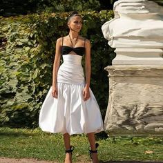 Introducing our White Satin Mermaid Skirt, a timeless and elegant piece that exudes sophistication and charm. Crafted from luxurious satin fabric, this skirt boasts a high waist and pleated detailing that adds a touch of classic refinement to your ensemble. Its tea-length design strikes the perfect balance between modesty and allure, making it ideal for a variety of occasions, from birthdays to photoshoots.With its mermaid silhouette, this skirt accentuates your curves beautifully, creating a flattering and feminine look that's sure to turn heads. The crisp white color adds an air of purity and elegance, while the high-waisted design offers both style and comfort. Whether paired with a fitted blouse for a polished look or a flowy top for a more relaxed vibe, our White Satin Mermaid Skirt i Fitted Blouse, Conceptual Fashion, High Waist Fashion, Mermaid Skirt, Mermaid Silhouette, Flowy Top, Flowy Tops, Feminine Look, Tier Skirt