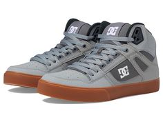 DC Pure High-Top WC - Men's Skate Shoes : Grey/White/Grey : Bring clean, classic skate style to your everyday with the DC Pure High-Top WC skateboard shoes! Skate shoes in a high-top silhouette. Leather, nubuck, suede, or canvas upper with premium textile quarter. Foam padded tongue and collar for added comfort and support. Mesh lining for breathable wear. Wrap cupsole construction for long-lasting durability. Abrasion-resistant sticky rubber outsole. Outsole features DC's trademarked Pill pattern tread. Imported. Measurements: Weight: 1 lb Product measurements were taken using size 11.5, width D - Medium. Please note that measurements may vary by size. Mid-top Suede Skate Shoes With Boost Midsole, Urban High-top Suede Sneakers With Gum Sole, Leather High-top Sneakers With Boost Midsole For Skateboarding, Leather High-top Sneakers With Round Toe For Skateboarding, Urban Leather High-top Sneakers For Skateboarding, Urban Suede High-top Sneakers With Gum Sole, Leather Skate Shoes With Boost Midsole, High-top Suede Skate Shoes For Sports, High-top Suede Sneakers For Skateboarding