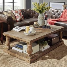 a living room with leather couches and a coffee table