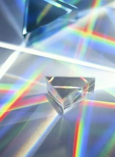 an image of a diamond that is being viewed from the ground with rainbow light coming through it