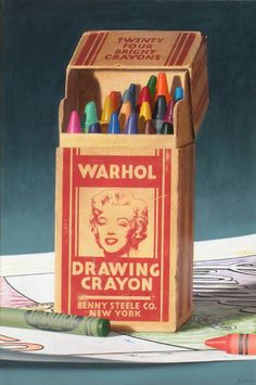 a box of drawing crayons sitting on top of a table