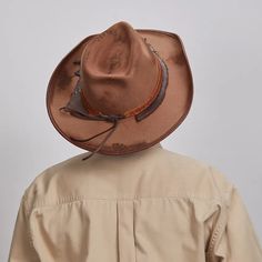 Duke | Mens Brown Felt Cowboy Hat merges rugged style with refined detail. Made from midweight wool felt and cowhide leather, it features a textured leather band with scrap material, feather accents, and a bound edge—perfect for men seeking a bold, stylish cowboy look. Material: Midweight Wool Felt and Cowhide Leather Shape: Cowboy Trim: Textured Leather Band with Antique Square Nail, and Feather Brim Size: 3 1/2" Crown Height: 4" Sweatband: AHM Velcro Imported Rugged Hunting Hat With Curved Brim, Vintage Distressed Brown Hat For Country Events, Rugged Ranch Hat With Curved Brim, Rugged Curved Brim Hat For Ranch, Rustic Hat With Distressed Brown Curved Brim, Rustic Hat With Distressed Brown Color And Curved Brim, Rugged Flat Brim Hat For Ranch, Rugged Flat Brim Hunting Hat, Rustic Hat With Curved Brim In Distressed Brown