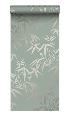 a wallpaper with bamboo leaves on it in grey and beige colors, as well as the