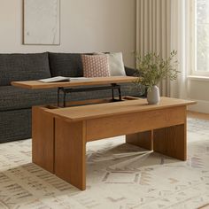 a living room scene with focus on the coffee table and sofa in the foreground