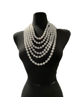 This Draped multi strand Pearl can be worn two ways with chain at the back or at the front. • Color : Cream, Gold• Theme : Pearl • Necklace Size : 17" + 3" L • Decor Size : 17" L • Earrings Size : 1.75" L Multi-strand Pearl Chain Necklace, Multi-strand Pearl Chain Necklaces, White Multi-strand Layered Necklace With Pearl Chain, Luxury Multi-strand Pearl Chain Beaded Necklaces, Luxury Multi-strand Pearl Chain Necklace, Pearl Strands, Bib Necklace, Necklace Sizes, Multi Strand