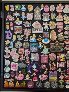 the back of a refrigerator covered in lots of stickers and magnets on it