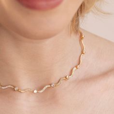 Delicate and unique, this stunning necklace is a perfect piece to compliment any fit. 18K gold plated, copper AAA cubic zirconia crystal Length: 14.5in(+ 2.4in adjustable) Hypoallergenic, lead & nickel free If you aren't in LOVE with your purchase, please let us know within 30 days of receiving your item, and you'll receive a stress-free refund. Gold Cubic Zirconia Bridal Choker, Adjustable Rhinestone Necklace As Gift, Elegant Adjustable Gold Crystal Necklace, Elegant Adjustable Crystal Necklace, Elegant Adjustable Cubic Zirconia Rhinestone Necklace, Adjustable Cubic Zirconia Clavicle Necklace, Adjustable Cubic Zirconia Necklace With Sparkling Stones, Elegant Gold-plated Crystal Necklace With Adjustable Chain, Elegant Cubic Zirconia Crystal Choker Necklace