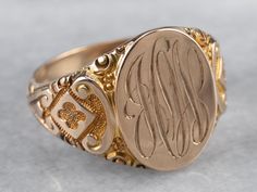 This antique Ostby Barton signet ring is stunning! Deeply carved designs along the shoulders form ornate textures, enhanced by a granulated finish that gives the 10k gold a luxurious look. We've left the original monogram – a stylish hand engraved French script! Please note that this signet ring has its original monogram, and unfortunately, this piece cannot be altered without affecting the quality of the piece. Please feel free to contact us to help you find your perfect signet ring in your sty Ceremonial Oval Signet Ring Stamped 14k, Heirloom Oval Signet Ring For Ceremonial Occasions, Gold Engraved Signet Ring Collectible, Ceremonial Gold Engraved Ring, Victorian Engraved Yellow Gold Ring With Intaglio, Victorian Yellow Gold Engraved Ring With Intaglio, Formal Oval Carved Signet Ring, Ceremonial Gold Engraved Ring With Engraving Option, Victorian Gold Signet Ring For Formal Occasions