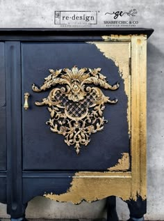 an ornate black and gold cabinet against a wall