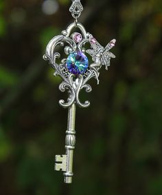 This magical silver plated fairy key necklace is a well kept secret among the fae folk as it opens the lock to the fairy world and beyond.  Experience the mischief of owning this large fantasy key which features a captivating Swarovski crystal and a cute little fairy who closely guards it. Swarovski brand crystals are known for their brilliant sparkle and precision craftmanship making them the highest quality crystal in the world! The key pendant measures 3" x 1 1/2" (7.62cm x 3cm) and the chain Old Keys, Skeleton Keys, Key Jewelry, Keys Art, Magical Jewelry, Key To My Heart, Key Necklace, Key Pendant, Fantasy Jewelry