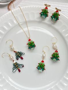 Get into the holiday spirit with this charming Christmas Tree Earrings and Necklace Set! Each piece is intricately handcrafted with vibrant beads in festive green and red hues, forming a delightful mini Christmas tree. Paired with elegant baroque pearls, these pieces add a unique, playful twist to your holiday wardrobe. Whether you're looking for a unique accessory to complement your seasonal outfit or searching for a thoughtful holiday gift, this jewelry set is the perfect choice. Make a festive statement and embrace the joy of the season with this beautifully designed set, ideal for holiday parties or everyday wear throughout December. Spread holiday cheer with every sparkle! A Handmade Token of Love Ship from: California Materials: sterling silver,14cara gold filled ,freshwater pearl,gl December Spread, Christmas Beaded Jewelry, Holiday Beaded Jewelry, Holiday Jewelry Ideas, Christmas Jewelry Diy, Beautiful Beaded Jewelry, Earrings Necklace Set, Holiday Beading, Earrings And Necklace Set