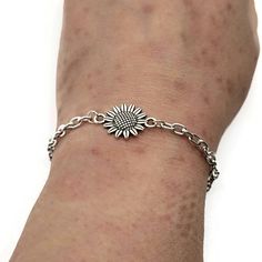 This 0.8-inch sunflower charm comes on a 2mm wide, stainless steel chain with lobster clasp. Bracelet includes special card and gift box. Choose your size. Size ranges will comes with a 2 inch extender, great for gift giving when you don't know the recipient's size! Everyday Hypoallergenic Stainless Steel Jewelry, Adjustable Hypoallergenic Stainless Steel Chain Bracelet, Adjustable Stainless Steel Chain Bracelet For Friendship, Dainty Nickel-free Metal Charm Bracelet, Dainty Adjustable Stainless Steel Charm Bracelet, Adjustable Dainty Stainless Steel Charm Bracelet, Adjustable Stainless Steel Chain Bracelet With Extender, Dainty Metal Charm Bracelet With Lobster Clasp, Friendship Stainless Steel Jewelry With Charms