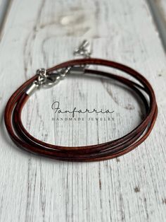 "Introducing the 'Rustic Wrap' Multistrand Leather Bracelet - a true embodiment of classic craftsmanship and natural style. This bracelet features multiple strands of supple brown leather, carefully designed to wrap comfortably around your wrist, creating a layered look that's both stylish and substantial. Secured with a sturdy clasp, it's adjustable to ensure the perfect fit for any wrist size. Whether it's a casual day out or an evening event, this wrap bracelet is the ideal accessory to bring Brown Leather Strap Bracelet, Brown Leather Wrap Bracelet As Gift, Brown Leather Wrap Bracelet Gift, Brown Leather Wrap Bracelet For Gift, Elegant Handmade Brown Braided Bracelets, Elegant Brown Wrap Bracelet As A Gift, Brown Double Band Bracelet With Leather Strap, Brown Double Band Leather Strap Bracelets, Brown Leather Strap Double Band Bracelets