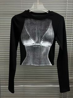 This is perfect for those who are looking for a clothing for a good price. It is fashionable, stylish, and it will look great on anyone who wears it. Do you wanahavit? Fitted Long Sleeve Crop Top With Graphic Print, Trendy High Stretch Crew Neck Tops, Black Long Sleeve Tops With Screen Print, Trendy Black Tops With Graphic Print, Black Stretch Graphic Tee, High Stretch Cotton Crew Neck Top, Edgy Fitted T-shirt For Fall, Edgy Fitted Fall T-shirt, Edgy High Stretch Tops For Summer