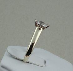 "This classic dazzling marquise cut diamond solitaire in 14K yellow gold is representative of the traditional promise ring. The diamond is set high enough to allow for the future addition of a wedding band. FREE SHIPPING! Details: 14k Yellow Gold (shown in picture) Natural Diamond: (1) 4.1 mm x 7.4 mm marquise Approximate Diamond Weight: 0.40 ctw Diamond Clarity: SI3 Diamond Color: H Ring Size: 7 Total Weight: 3.5 grams FREE Domestic Shipping by USPS Priority Mail Signature Confirmation and incl Classic Marquise Cut Ring With Tension Setting, 14k Gold Marquise Cut Diamond Ring With Tension Setting, Classic Marquise Diamond Ring With Single Diamond, Classic Marquise Diamond Ring With Single Stone, Anniversary Solitaire Diamond Ring Marquise Cut, Classic Marquise Rings With Tension Setting, Anniversary Marquise Cut Solitaire Diamond Ring, Classic Marquise Cut Wedding Ring With Tension Setting, Marquise Solitaire Yellow Gold Diamond Ring