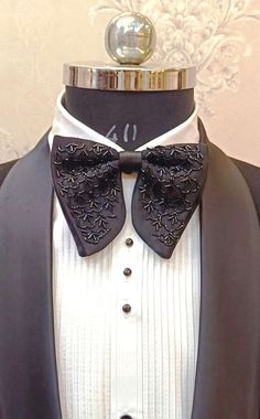 Suit up for your special occasion in my eye-catching satin bow tie with handwork of stone. I craft these by hand to my unique design using the finest quality n.blue satin & handwork material used very precious and they are just PERFECT for proms and black tie events. This satin bow tie is completely hand-stitched & hand crafted and has been created using finest silk thread and a slider so that it is fully adjustable to a perfect fit. It will accommodate a collar of any size between 14" and 19" as standard. If you need it in a larger size just let me know your collar measurement and I can make the strap longer for you. Getting married? These bow ties make for a very dapper groom and groomsmen! The item is made to order and is usually ready to dispatch in 4-8 business days, however if you ne Elegant Satin Suit And Tie Accessories For Wedding, Elegant Satin Suit Accessories For Wedding, Satin Tuxedo For Black-tie Events, Satin Suit And Tie Accessories For Wedding, Elegant Satin Tuxedo For Party, Wedding Satin Standard Tie, Satin Fitted Tuxedo For Black-tie Events, Classic Wedding Tuxedo With Bow, Black Fitted Bow For Wedding