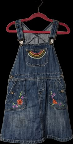 ◇ Indulge Vintage is a curated collection of unique and storied wares for maximalists ◇Oshkosh's kids’ blue and multicolor, cotton skirt overalls. Cute little hand embroidered overall dress.Excellent condition, probably a size 6/7 years. Detailed measurements (taken flat):Waist - 12 inches (double)Hip - 14 inches (double)All measurements are taken flat in inches! When considering fit, compare it to a similar garment you own that fits well. For bust, waist, and hip measurements, double it to get the full circumference.Indulge Vintage link: https://shopthrilling.com/collections/indulge-vintageGive my shop a ❤️ so you can find Indulge Vintage again! Artsy Clothing Aesthetic, Clothes With Embroidery, Embroidered Overalls, Overalls Cute, 90s Skirt, Skirt Overalls, Overall Skirt, Kids Overalls, 90s 00s