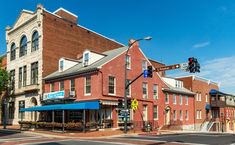 an old brick building on the corner of a street