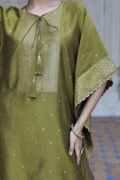 Mehendi green three fourth batwing sleeves kaftan crafted in vegan silk with edelweiss bloom woven detail in gold tone and woven buttis highlights. Paired with a matching straight pant. - Aza Fashions Green Tunic Kaftan For Festive Occasions, Green Tunic Kaftan For Festivals, Festive Green Tunic, Green Festive Tunic, Elegant Green Kaftan For Festivals, Elegant Green Festival Kaftan, Green Festive Tunic For Eid, Festive Green Bohemian Tunic, Elegant Green Tunic Kurta