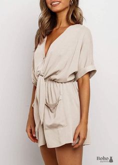 Jumpsuit romper in a Bohemian style! This wide boho jumpsuit romper is one of our favorites because it has a sophisticated allure and a comfortable style. It has a v-neck and two buttons on the front of it. waistband that stretches and has a ribbon tie. Sleeves shaped like bats and collars. shorts with a flared leg and two patch pockets on the front. This combi short is all about comfort because of its flowing fabric and loose shape, and we just adore it for that reason. Dress it up with a pair of heels or keep it casual with a pair of slippers. Most importantly, it can be worn all the time! In the table below, you will find the size of the shorts. To find your size according to your measurements, click on the Size Guide button at the top right. Measurements (cm) S M L XL Chest 85 90 95 10 Elegant V-neck Jumpsuit For Beach, Beach V-neck Solid Color Jumpsuits And Rompers, V-neck Jumpsuits And Rompers With Pockets For Beach, Chic Summer Mini Jumpsuits And Rompers, Chic Summer Jumpsuits And Rompers Mini Length, V-neck Jumpsuits And Rompers For Summer Day Out, Summer Jumpsuits And Rompers With Tie Waist And V-neck, V-neck Solid Color Jumpsuits And Rompers For Vacation, Summer Beige V-neck Jumpsuits And Rompers