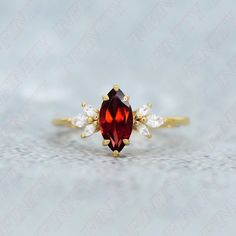 Ring Specifications & Details: Engagement/Wedding/Bridal Ring Stone Size: 10.00 X 5.00 mm Accents: Moissanite Stone Type: AAA Grade Red Garnet Gemstone Stone: Marquise Cut Natural Red Garnet Gemstone Metal Used: 925 Sterling Silver Plating Available: Rhodium/ Yellow/ Rose Gold We apply 2.5 micron of thicker plating on our rings. Stone CTW: 1.25 ctw   You may also favorite our studio for continuous updates on new designs and special discount coupons. Their would be special sale in the beginning o Heirloom Style Ruby Gemstone Ring For Wedding, Heirloom Style Ruby Ring For Wedding, Marquise Rings With Gemstone Accents For Anniversary, Marquise Cut Ruby Ring For Promise, Red Heirloom Jewelry For Wedding, Marquise Birthstone Ring In Fine Jewelry Style, Marquise Jewelry With Gemstone Accents For Anniversary, Anniversary Ruby Ring With Gemstone Accents, Anniversary Ruby Birthstone Ring With Gemstone Accents