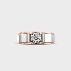 a white and rose gold ring with a diamond