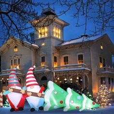 christmas decorations in front of a large house