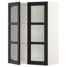 a white and black cabinet with glass doors on the front, and two shelves behind it