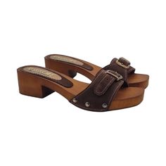 Comfortable, light and dynamic, our clogs will change even the most tenacious fans of high heels! Brown wood effect base Upper in brown suede with adjustable buckle Heel height 4.5 cm and 2 cm plateau Stable and comfortable made entirely in ITALY. Craftsmanship. BEFORE COMPLETING YOUR PURCHASE DO NOT FORGET TO CHECK THE SIZE! Brown Suede Sandals With Tang Buckle, Brown Mules With Tang Buckle, Suede Mules With Buckle Closure And Open Heel, Suede Clogs With Buckle Closure And Round Toe, Brown Suede Closed Toe Mules, Brown Slip-on Mules With Buckle Closure, Closed Toe Suede Clogs With Buckle Closure, Suede Closed Toe Clogs With Buckle Closure, Brown Open Toe Suede Mules