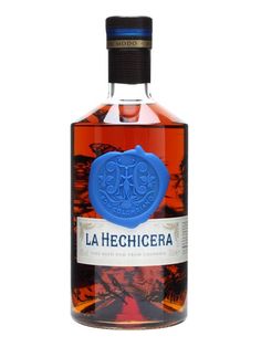 a bottle of la hechicera tequila on a white background