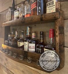 a wooden shelf filled with lots of bottles