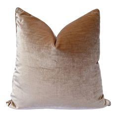 a tan pillow with a ruffled edge on a white background, it has a square shape