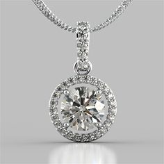 Give the gift of timeless elegance with this beautiful pendant. A breathtaking Simulated Diamond halo gracefully holds a brilliant center stone. Exquisitely made in 14K White Gold, the Pendant features a bail slide amidst additional simulated diamonds to add an extra pop of sparkle. Classy and chic, this is sure to please the goddess in your life. Round Cut Embelished Bail and Halo Pendant Center Stone: 2 CT Total Carat Weight: 2.33 CTW Stone Clarity: VVS-1 Precious Metal: 14K White Gold 16" Chain in 14K White Gold Included Model: PD2502-WH Memorable Jewelry, Jewelry Rendering, Diamond Pendant Sets, Diamond Solitaire Necklace, Halo Pendant, Solitaire Necklaces, Solitaire Pendant, Diamond Pendant Necklace, The Goddess