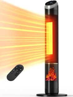 a remote control next to an electric fire heater with flames coming out of it