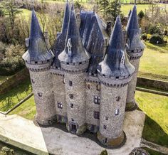 an aerial view of a castle with turrets